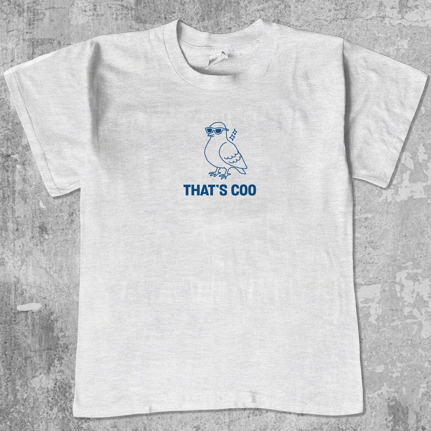 That's Coo graphic tee with bold and humorous print, funny and trendy graphic. Perfect for adults and gift-giving. Ash Grey shirt.