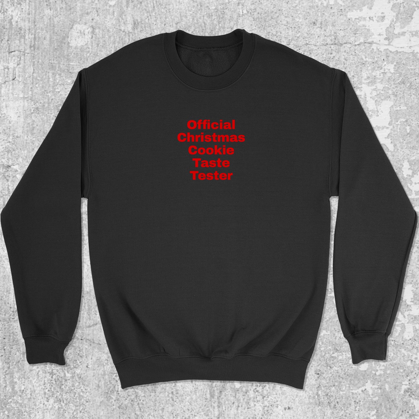 Official Christmas Cookie Taste Tester graphic sweatshirt with bold and humorous print, warm and cozy graphic for everyday wear. Perfect for adults and gift-giving. Black pullover.