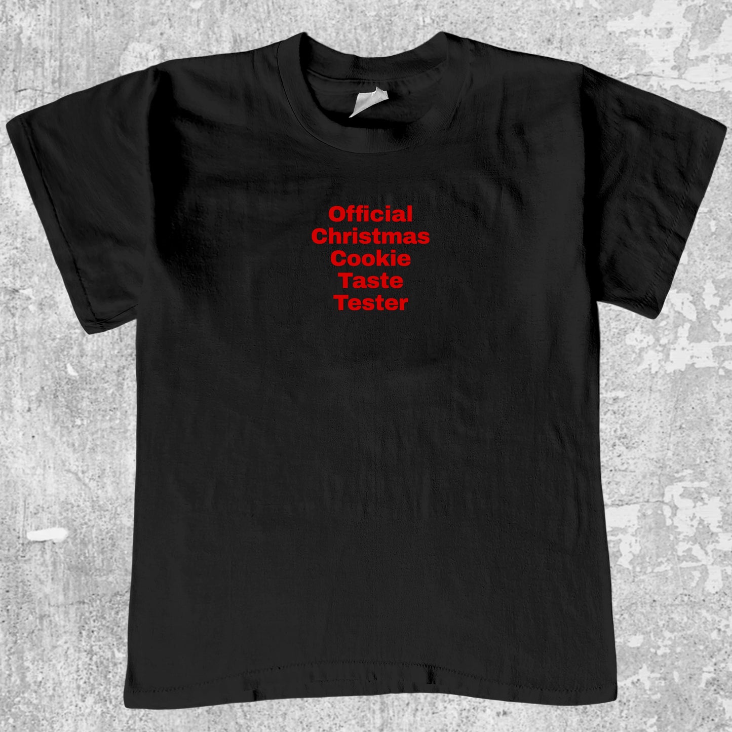 Official Christmas Cookie Taste Tester graphic tee with bold and humorous print, funny and trendy graphic. Perfect for adults and gift-giving. Black shirt.
