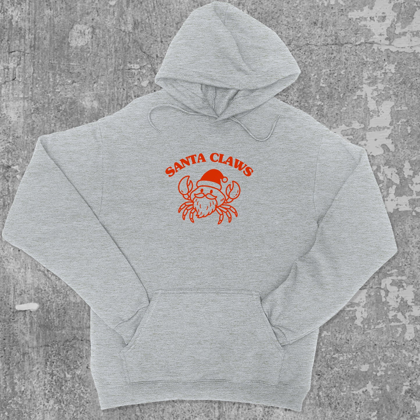 Santa Claws Crab graphic hoodie with funny and christmas artwork, casual streetwear with bold personality. Great for adults and gifting. Heather Grey hoodie.