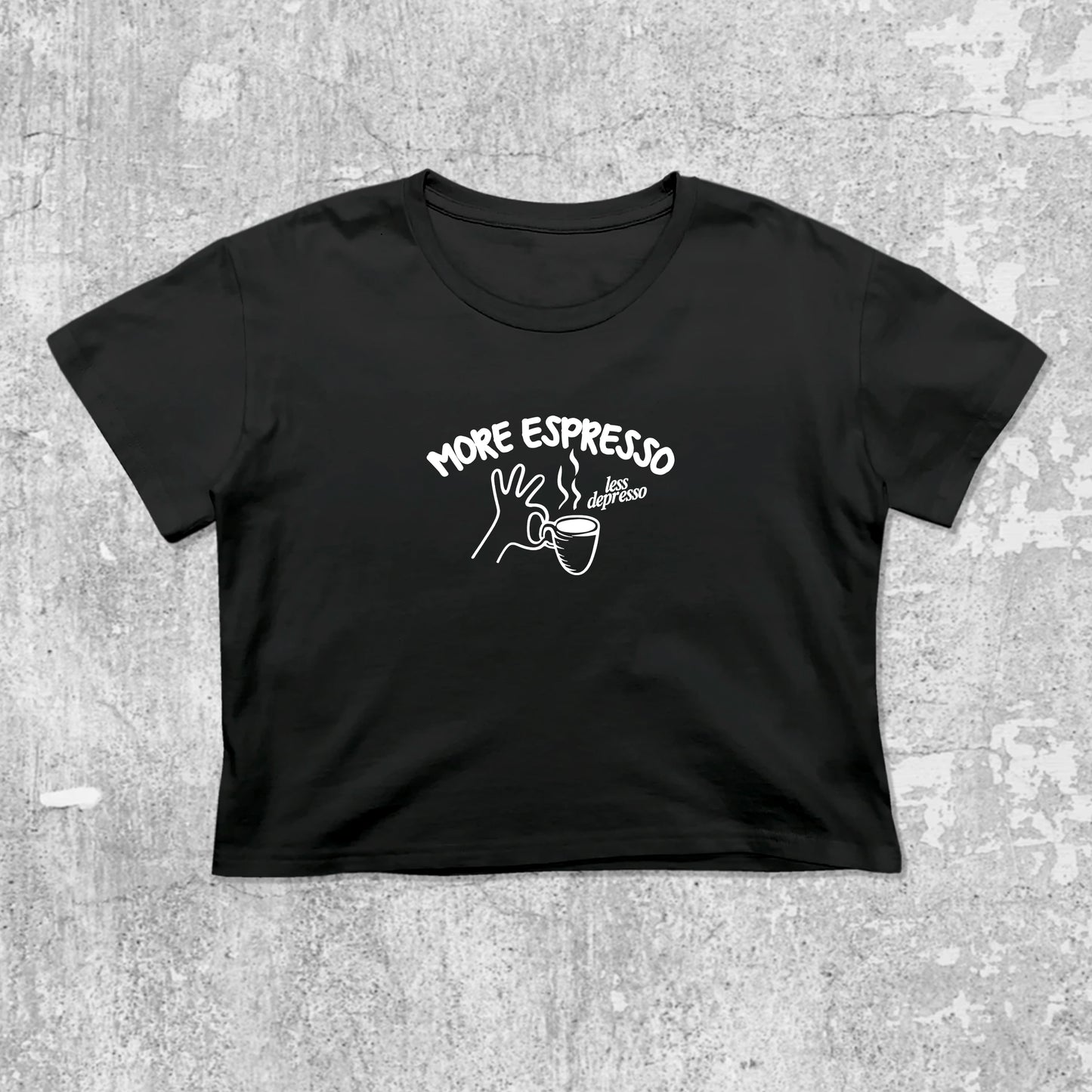 More Espresso Less Depresso graphic crop tee with cute and trendy fit, featuring playful coffee graphic, stylish cut. Black crop t-shirt