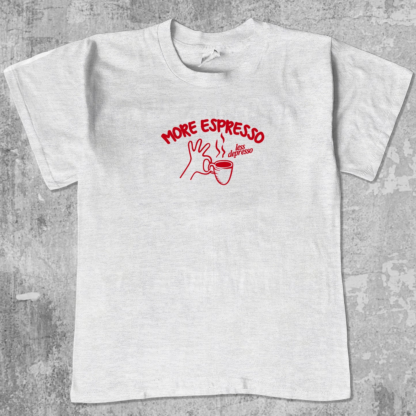 More Espresso Less Depresso graphic tee with retro coffee print, funny and trendy graphic. Perfect for friends. Ash Grey shirt.