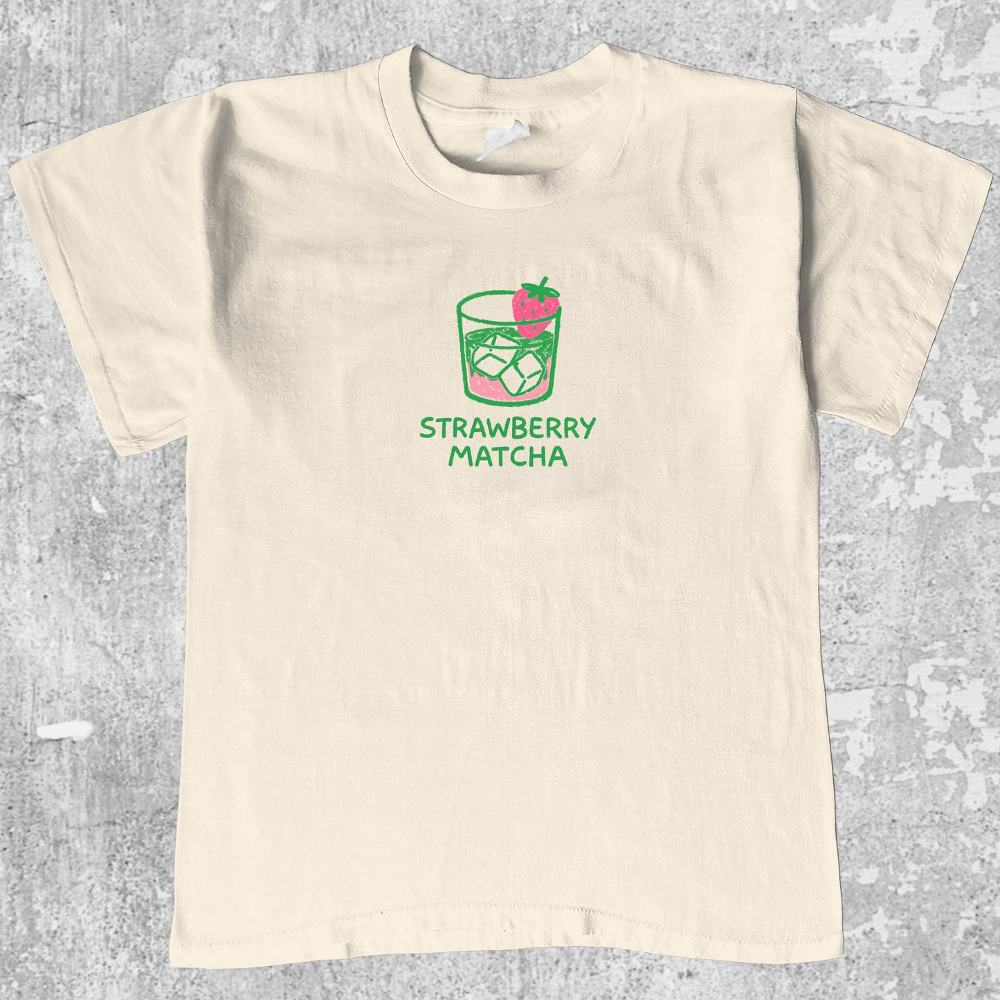 Strawberry Matcha graphic tee with pink green print, funny and simple graphic. Perfect gifts for family and friends. Cream shirt.