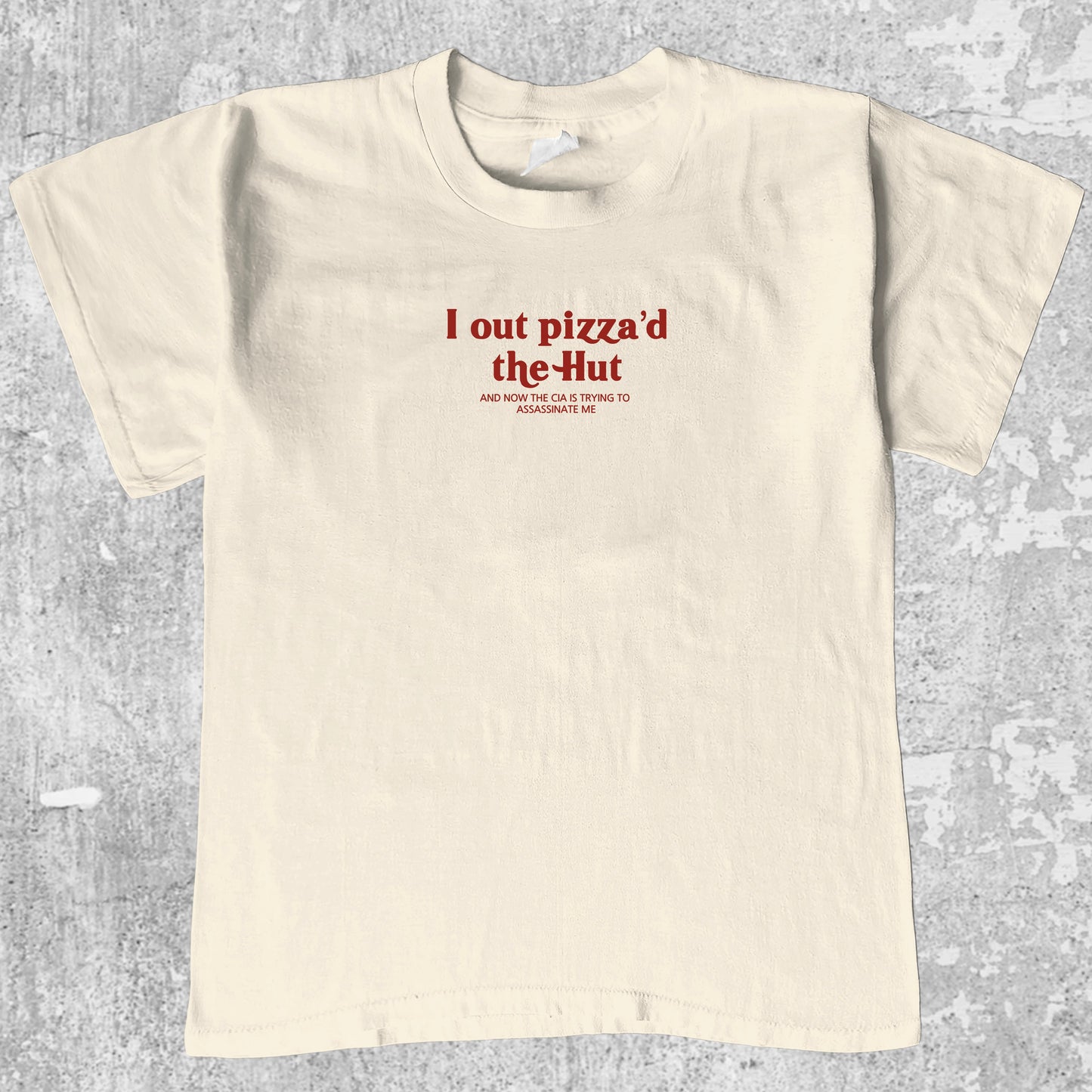I Out Pizza'd The Hut graphic tee with bold and humorous print, funny and trendy graphic. Perfect for adults and gift-giving. Cream shirt.