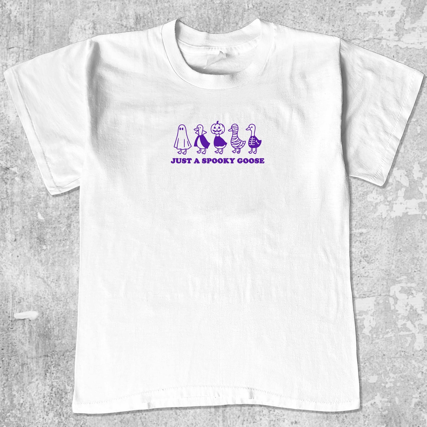 Just a Spooky Goose graphic tee with bold and humorous print, funny and trendy graphic. Perfect for special halloween. White shirt.