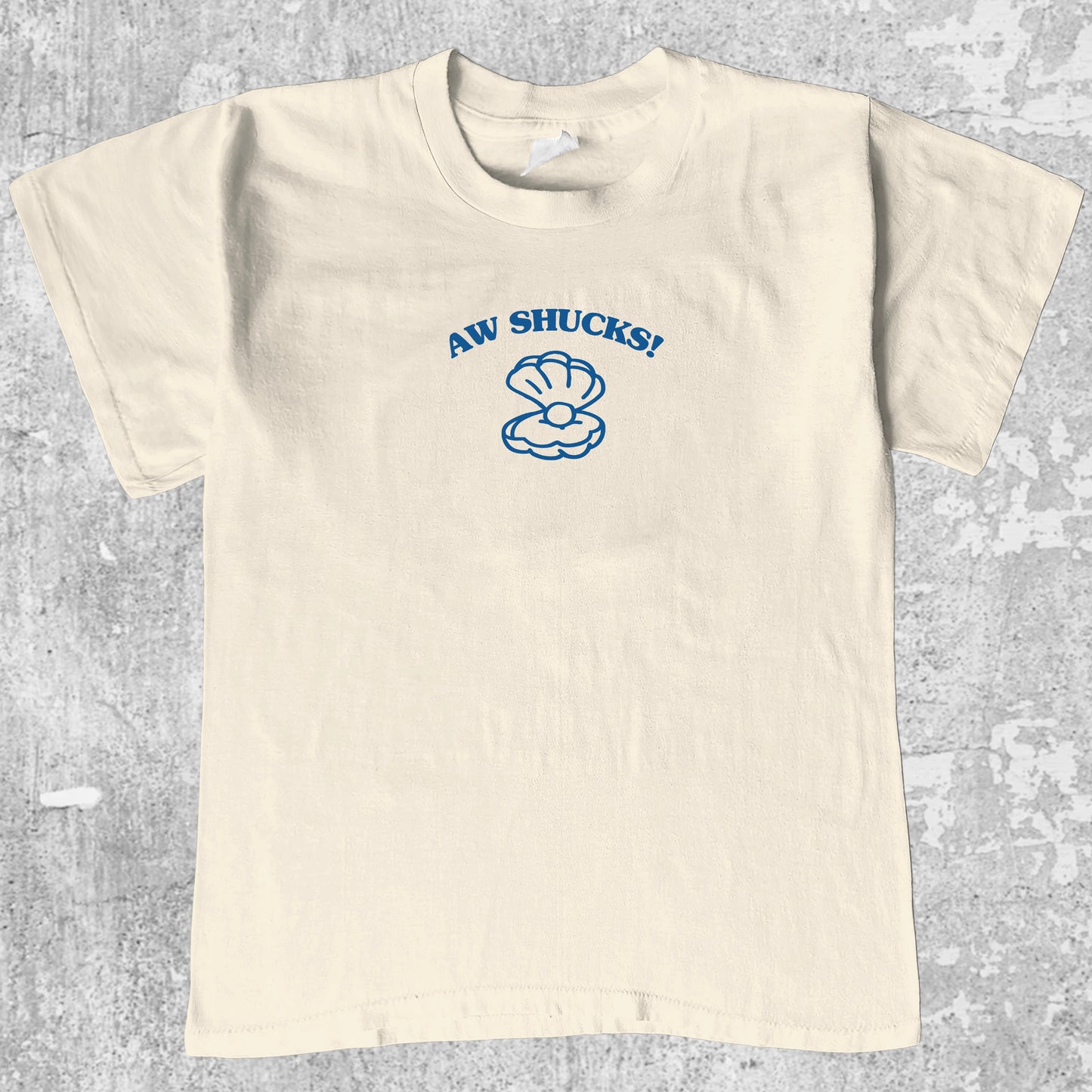 Aw Shucks graphic tee with bold and humorous print, funny and trendy graphic. Perfect for adults and gift-giving. Cream shirt.