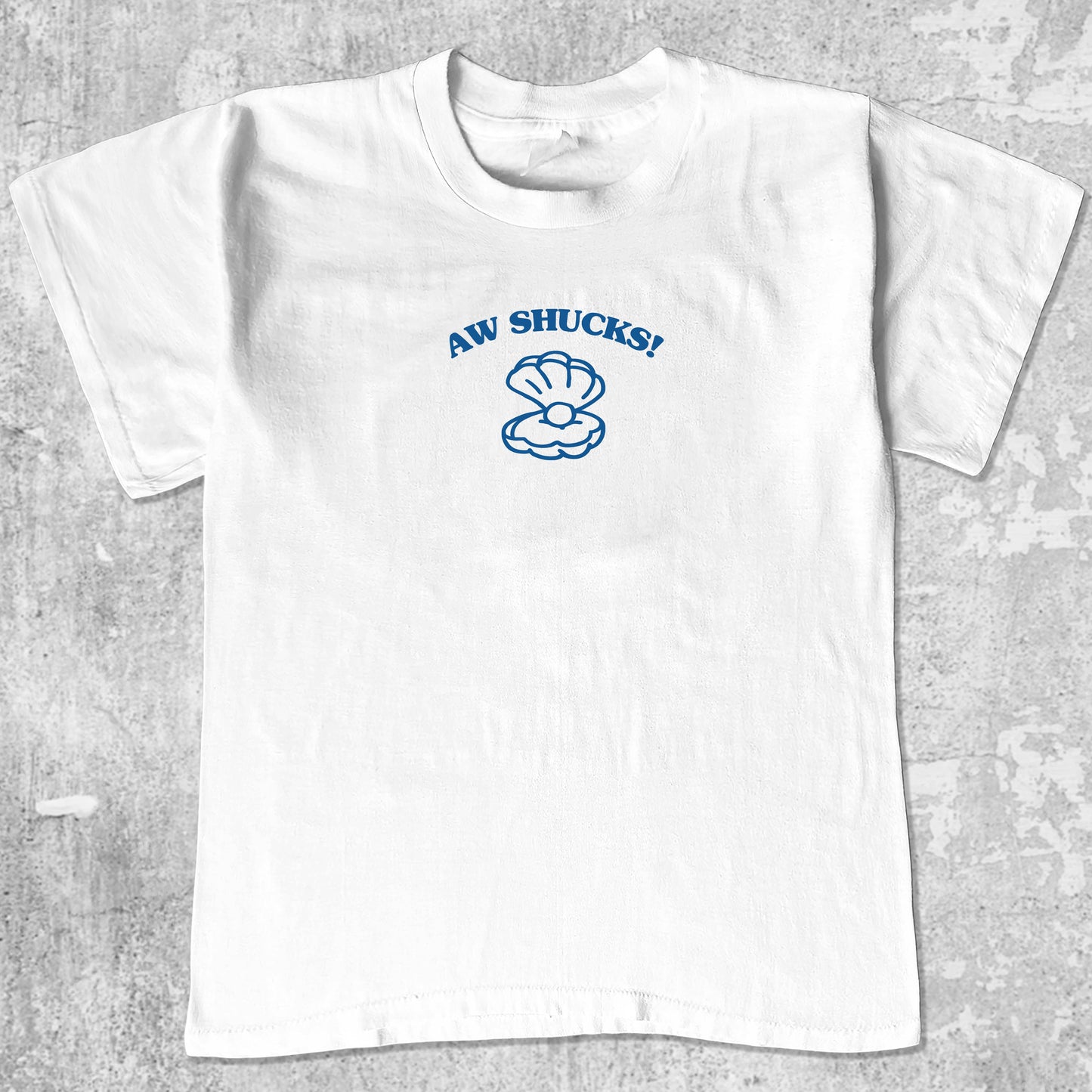 Aw Shucks graphic tee with bold and humorous print, funny and trendy graphic. Perfect for adults and gift-giving. White shirt.