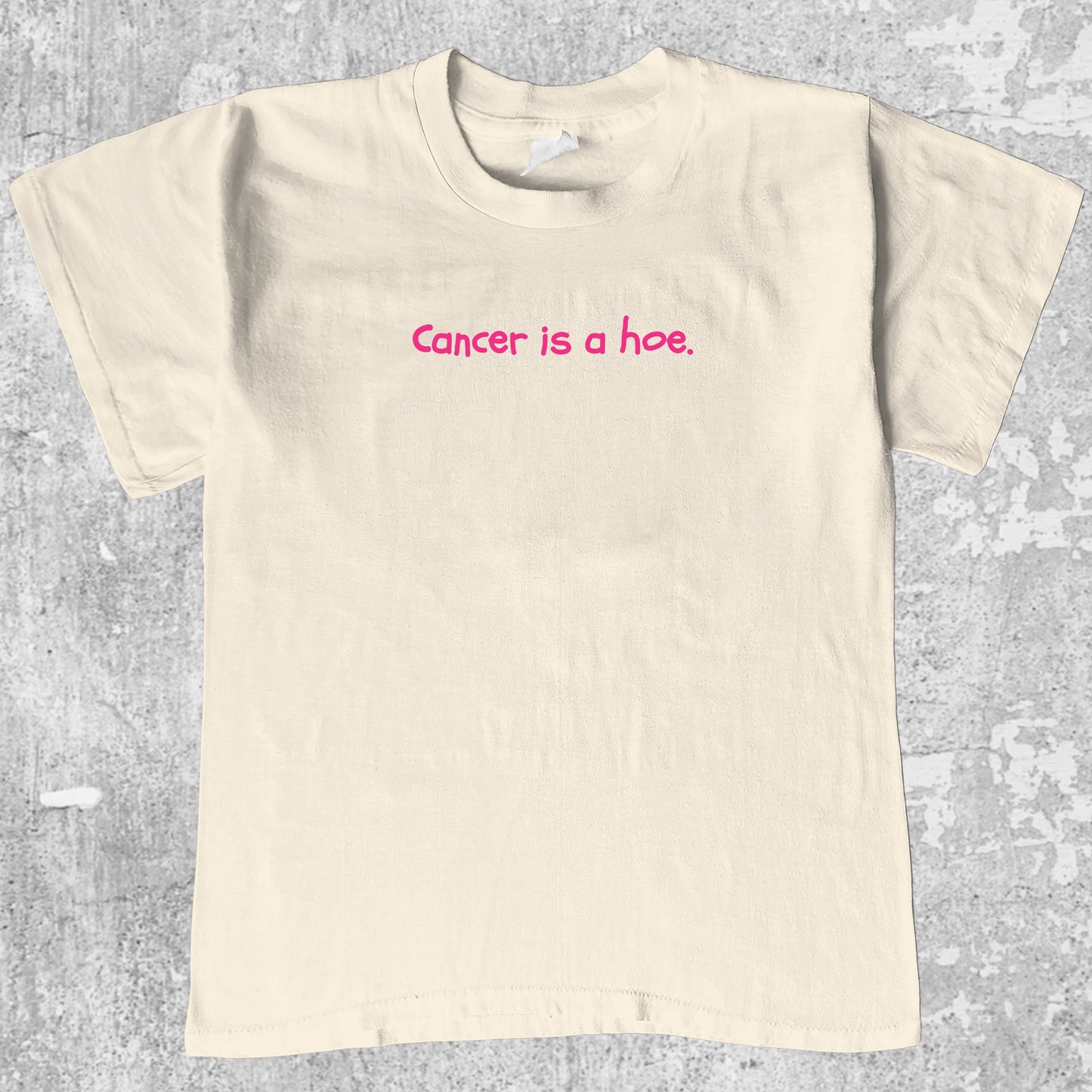 Cancer Is A Hoe graphic tee with breast cancer awareness graphic, funny and trendy graphic. Perfect for adults and gift-giving. Cream shirt.