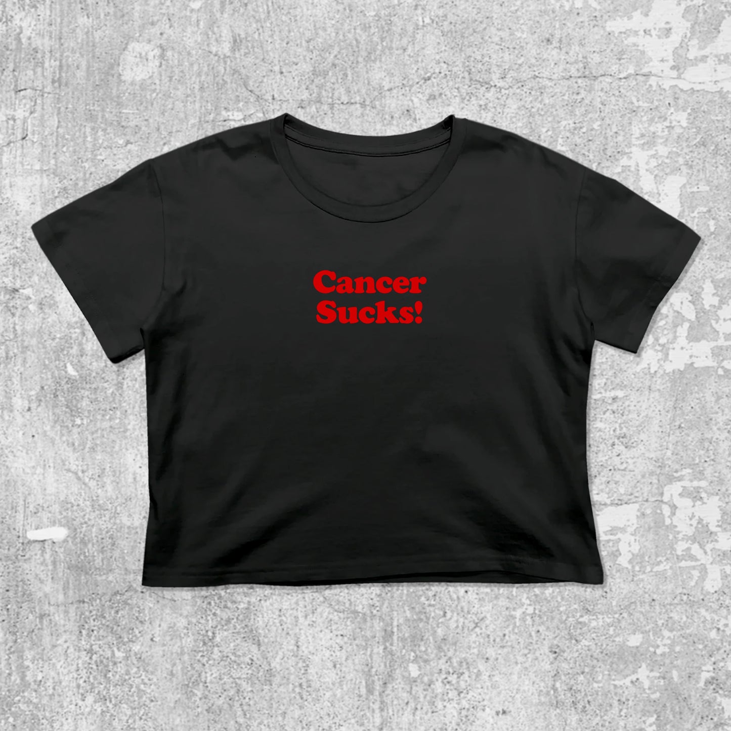Cancer Sucks graphic crop tee with cute and trendy fit, featuring playful vintage graphic, stylish cut. Black crop t-shirt