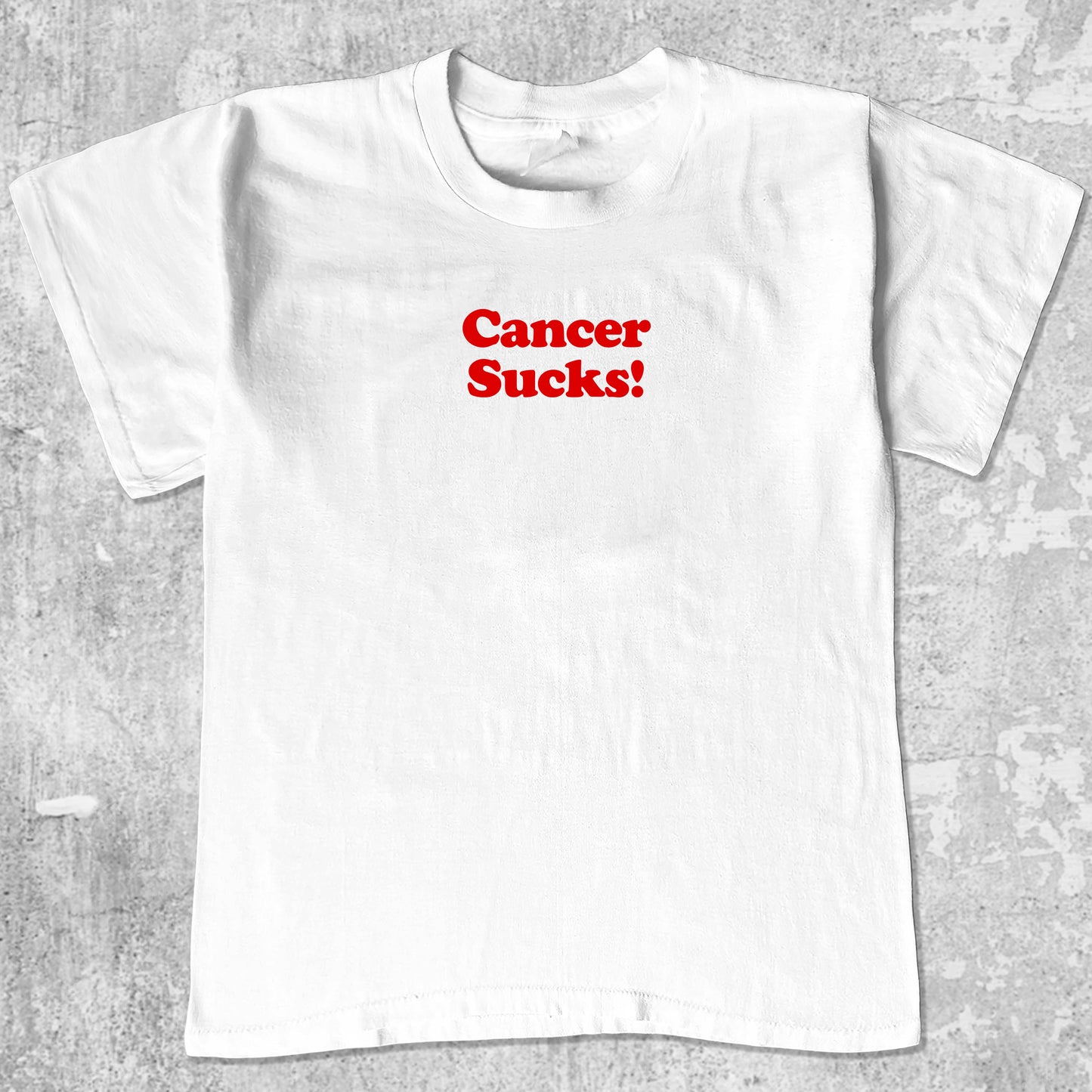 Cancer Sucks graphic tee with funny cancer print, funny and trendy graphic. Perfect for adults and gift-giving. White shirt.