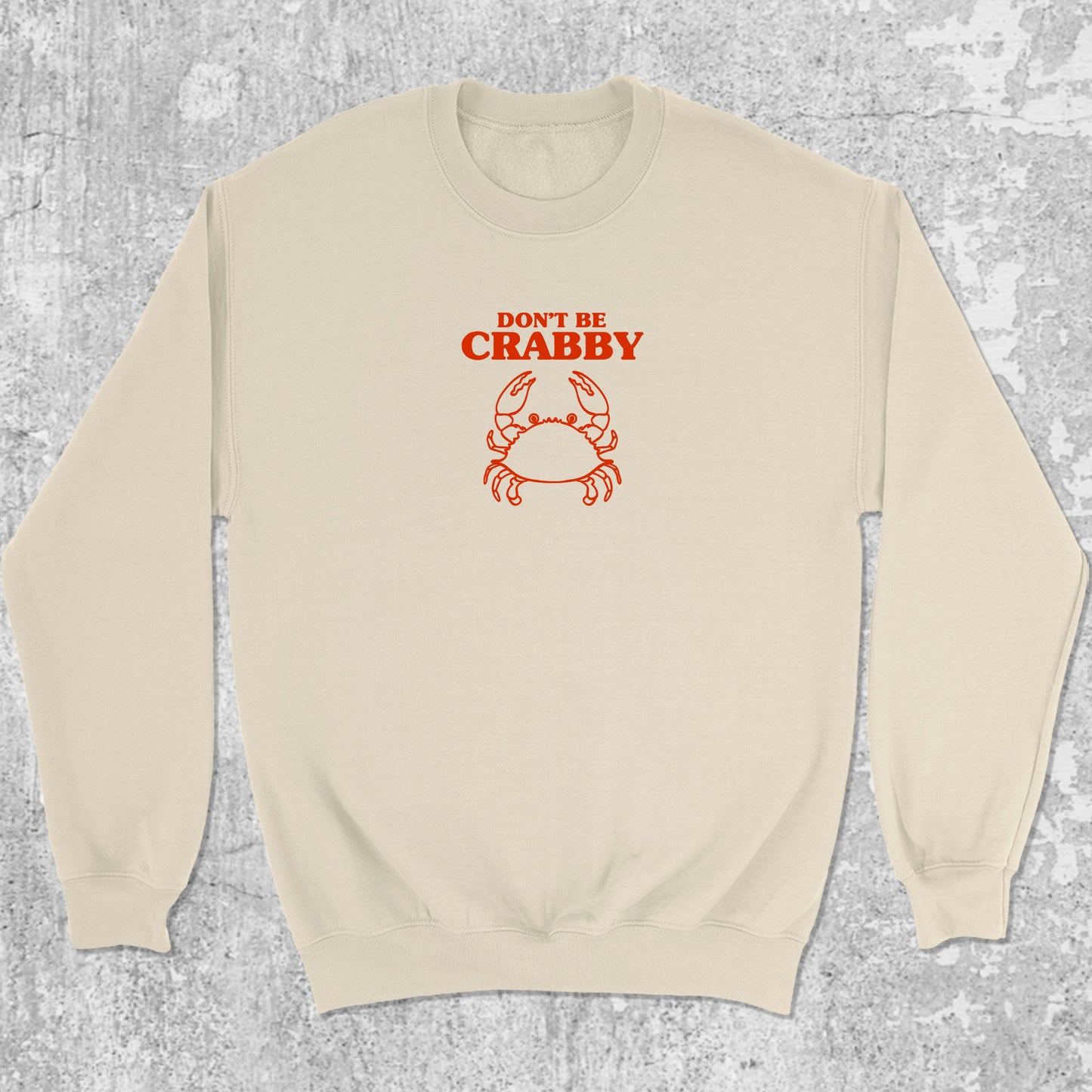 Don't Be Crabby graphic sweatshirt with bold and humorous print, warm and cozy graphic for everyday wear. Perfect for adults and gift-giving. Natural pullover.