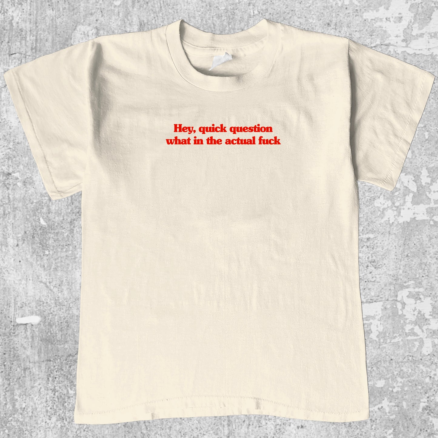 Hey quick question what in the actual fuck graphic tee with bold and humorous print, funny and trendy graphic. Perfect for adults and gift-giving. Cream shirt.