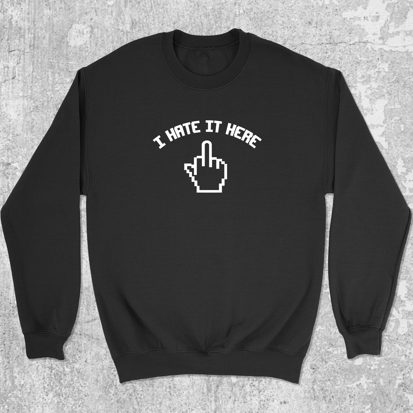 I Hate It Here graphic sweatshirt with bold and humorous print, warm and cozy graphic for everyday wear. Perfect for adults and gift-giving. Black pullover.