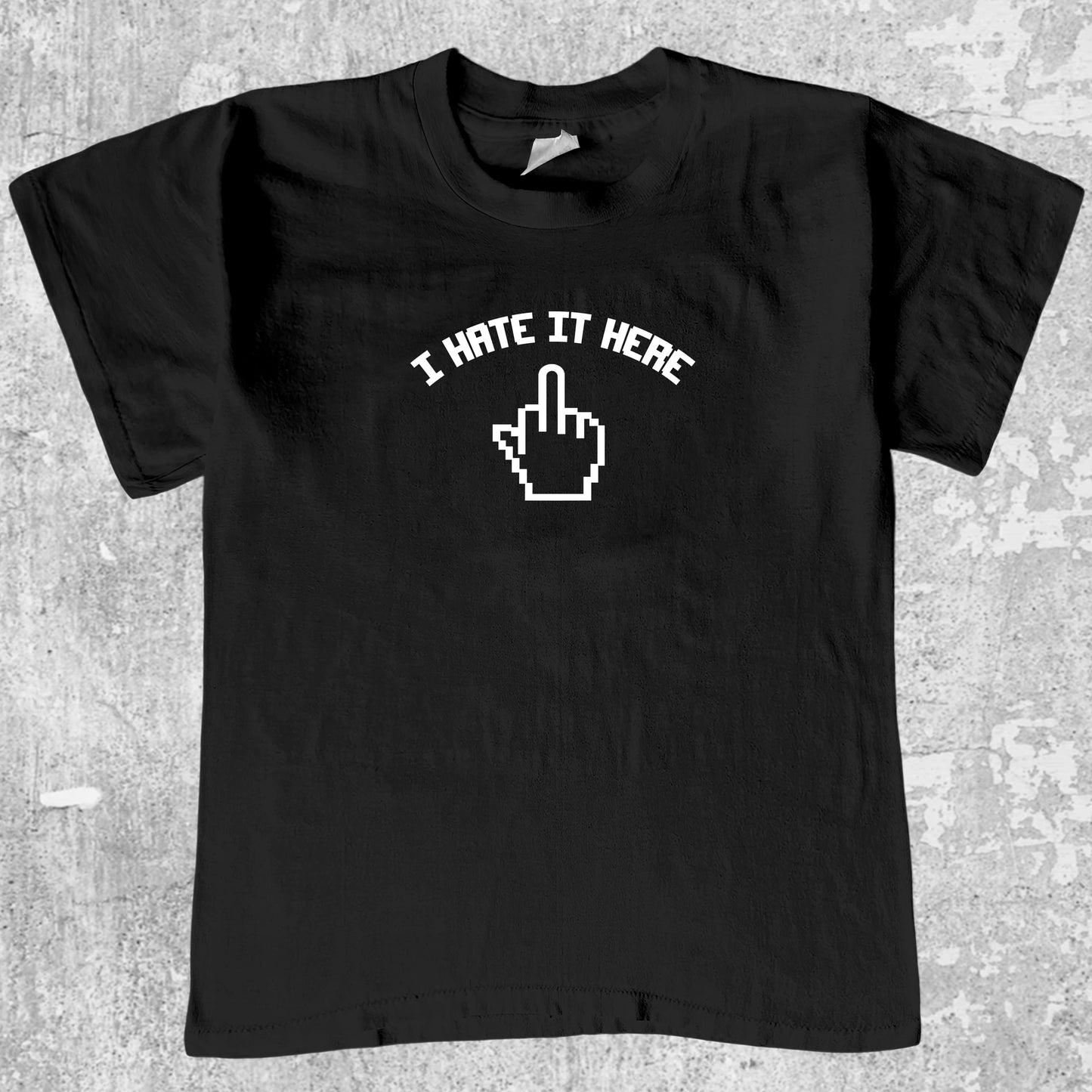 I Hate It Here graphic tee with bold and humorous print, funny and trendy graphic. Perfect for adults and gift-giving. Black shirt.