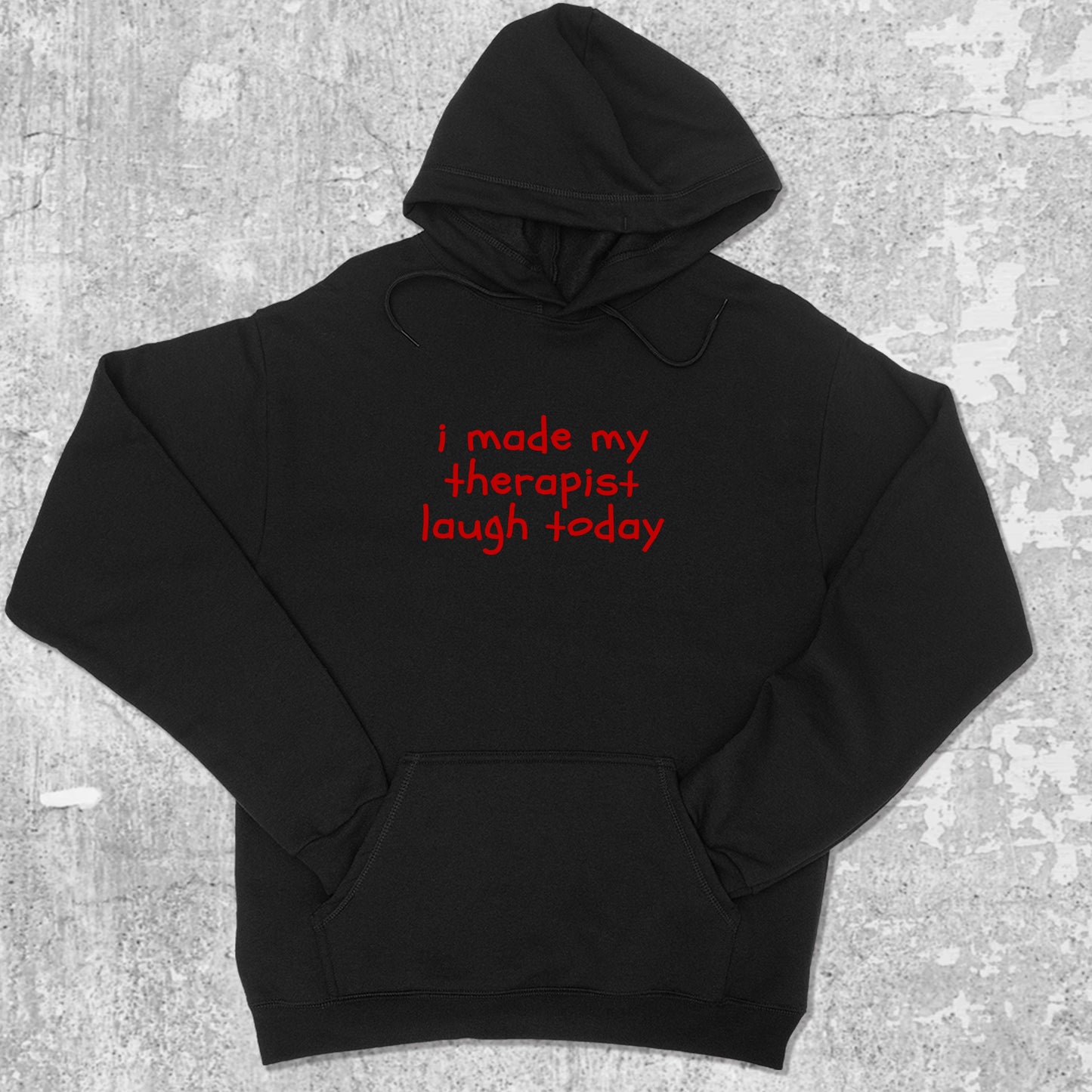 I Made My Therapist Laugh Today graphic hoodie with funny and trendy artwork, casual streetwear with bold personality. Great for adults and gifting. Black hoodie.