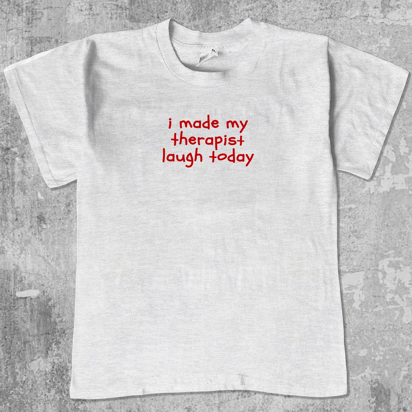 I Made My Therapist Laugh Today graphic tee with cute and humorous print, funny and Vintage graphic. Perfect for friends. Ash Grey shirt.