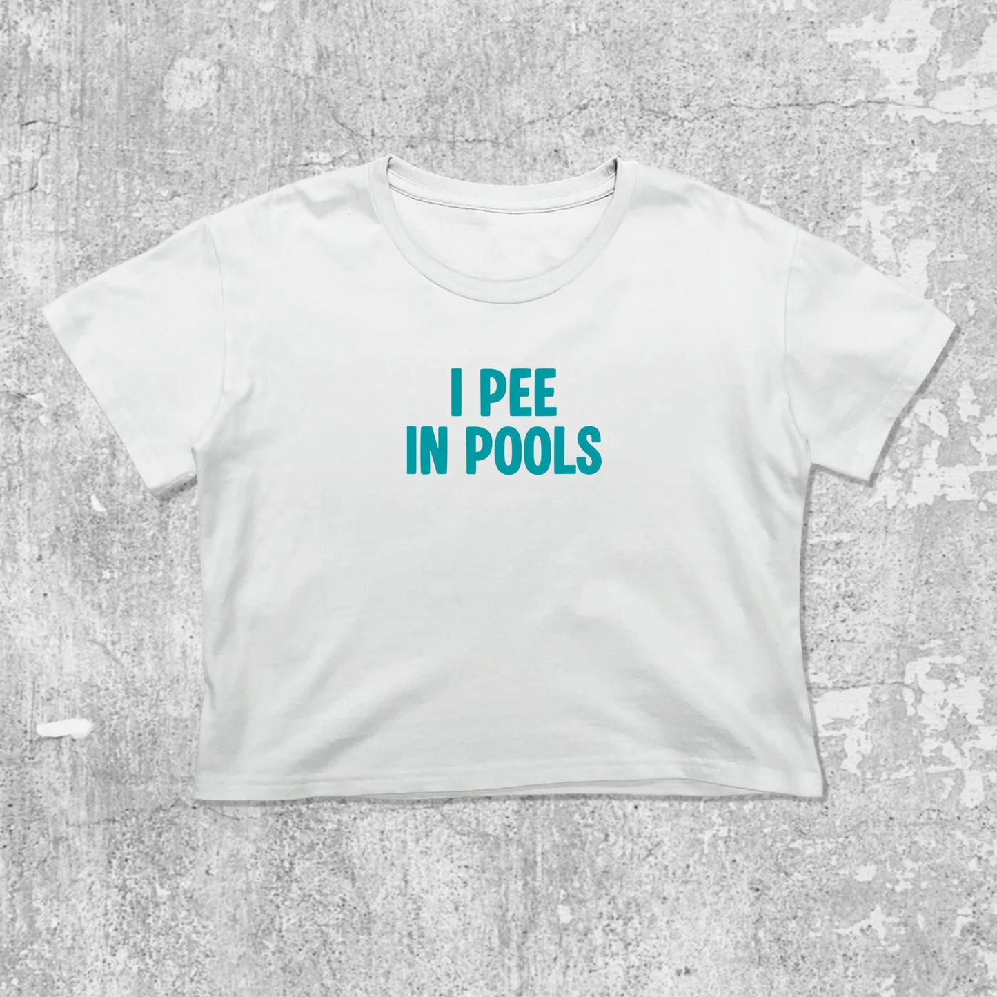 Pee In Pools graphic crop tee with cute and trendy fit, featuring playful vintage graphic, stylish cut. White crop t-shirt