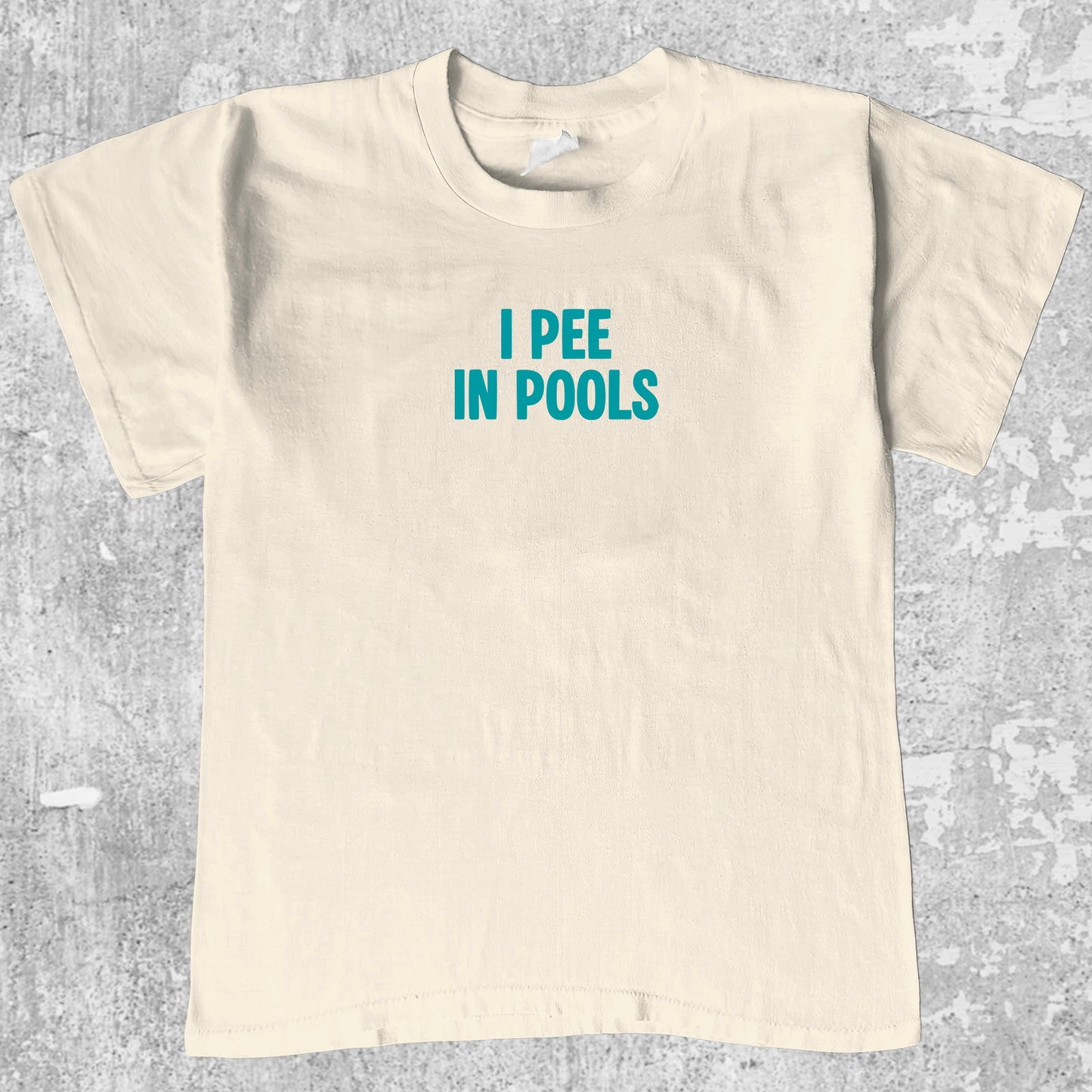 Pee In Pools graphic tee retro and funny graphic, funny and trendy graphic. Perfect for adults and gift-giving. Cream shirt.