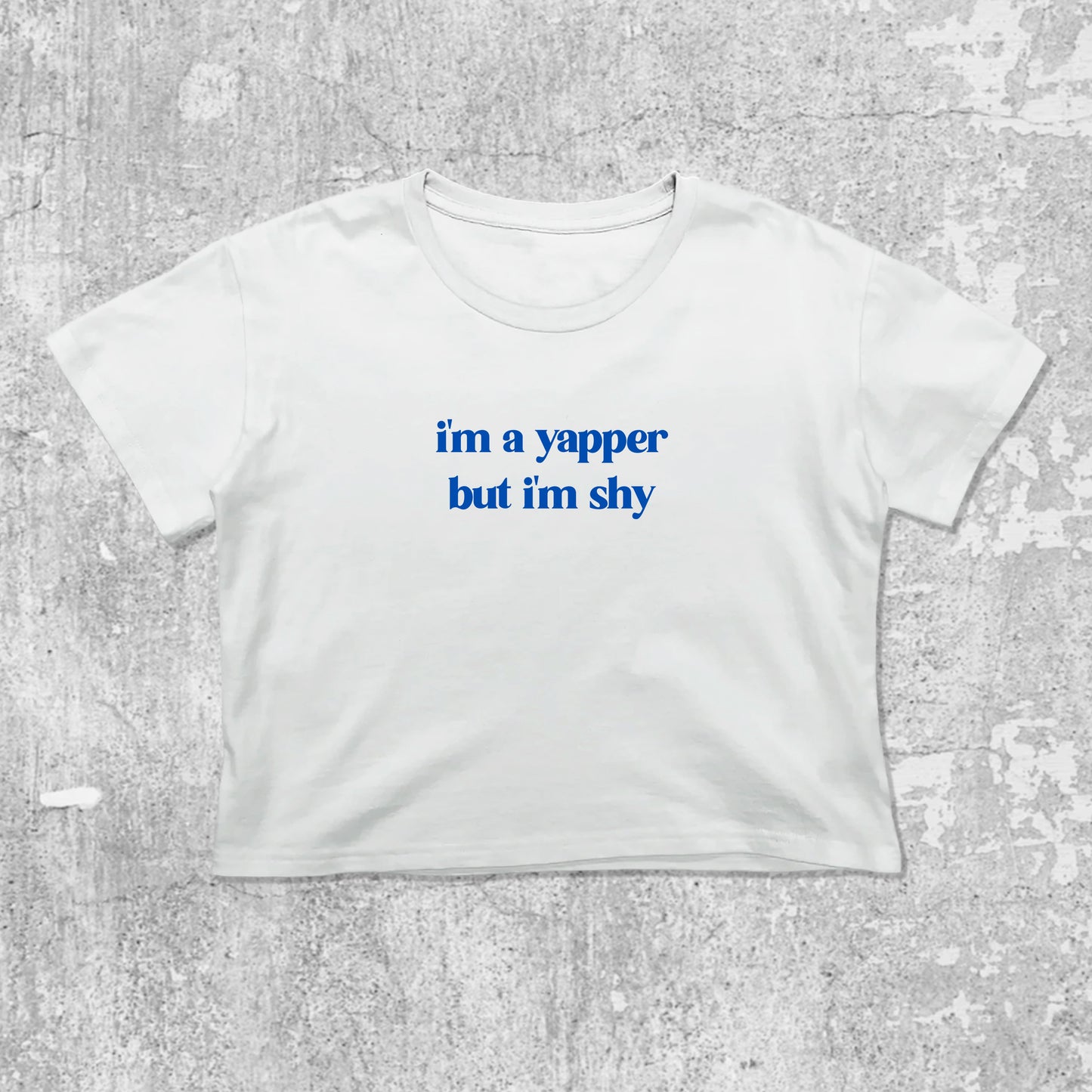 I'm A Yapper But I'm Shy graphic crop tee with cute and trendy fit, featuring playful vintage graphic, stylish cut. White crop t-shirt