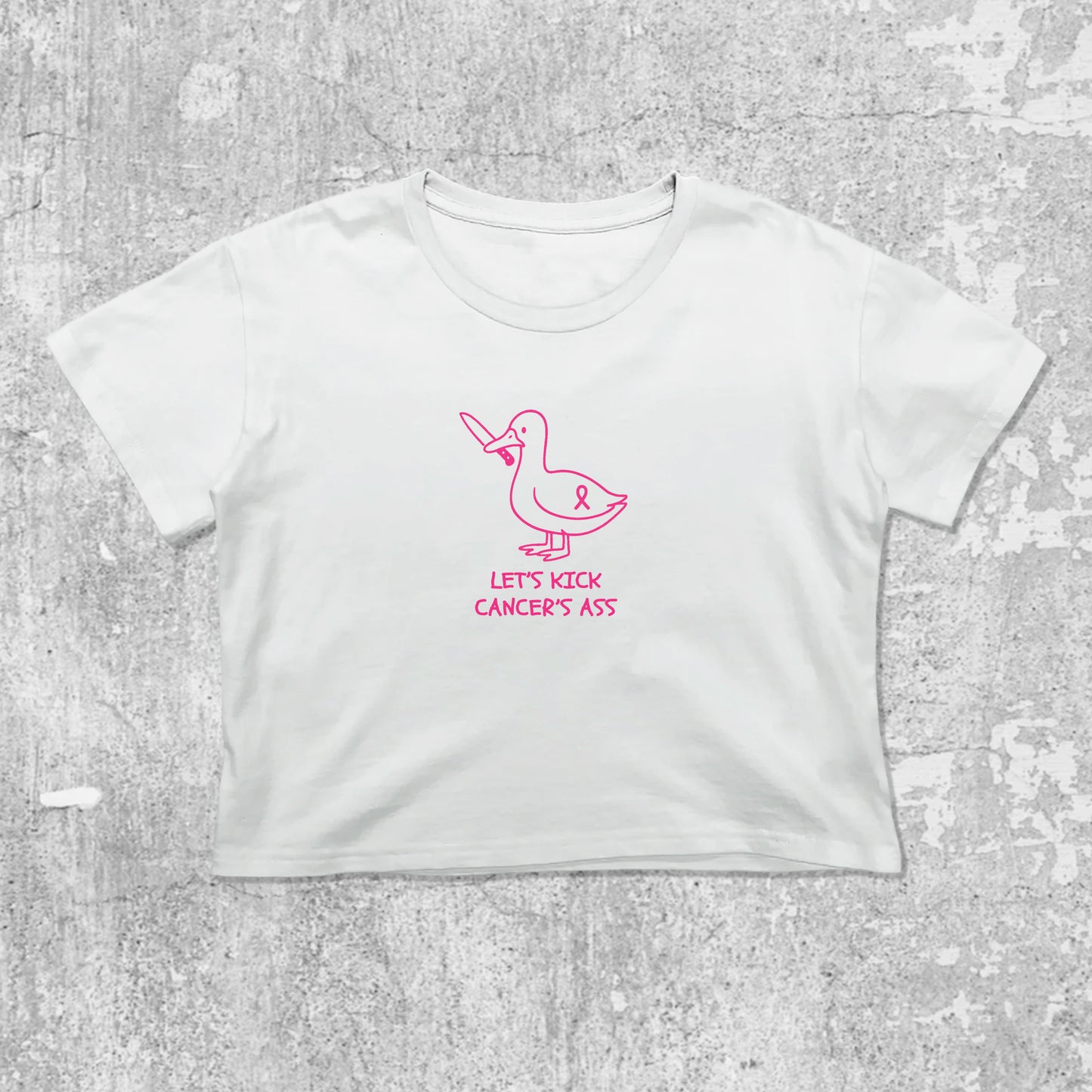 Let's Kick Cancers Ass graphic crop tee with cute and trendy fit, featuring playful vintage graphic, stylish cut. White crop t-shirt