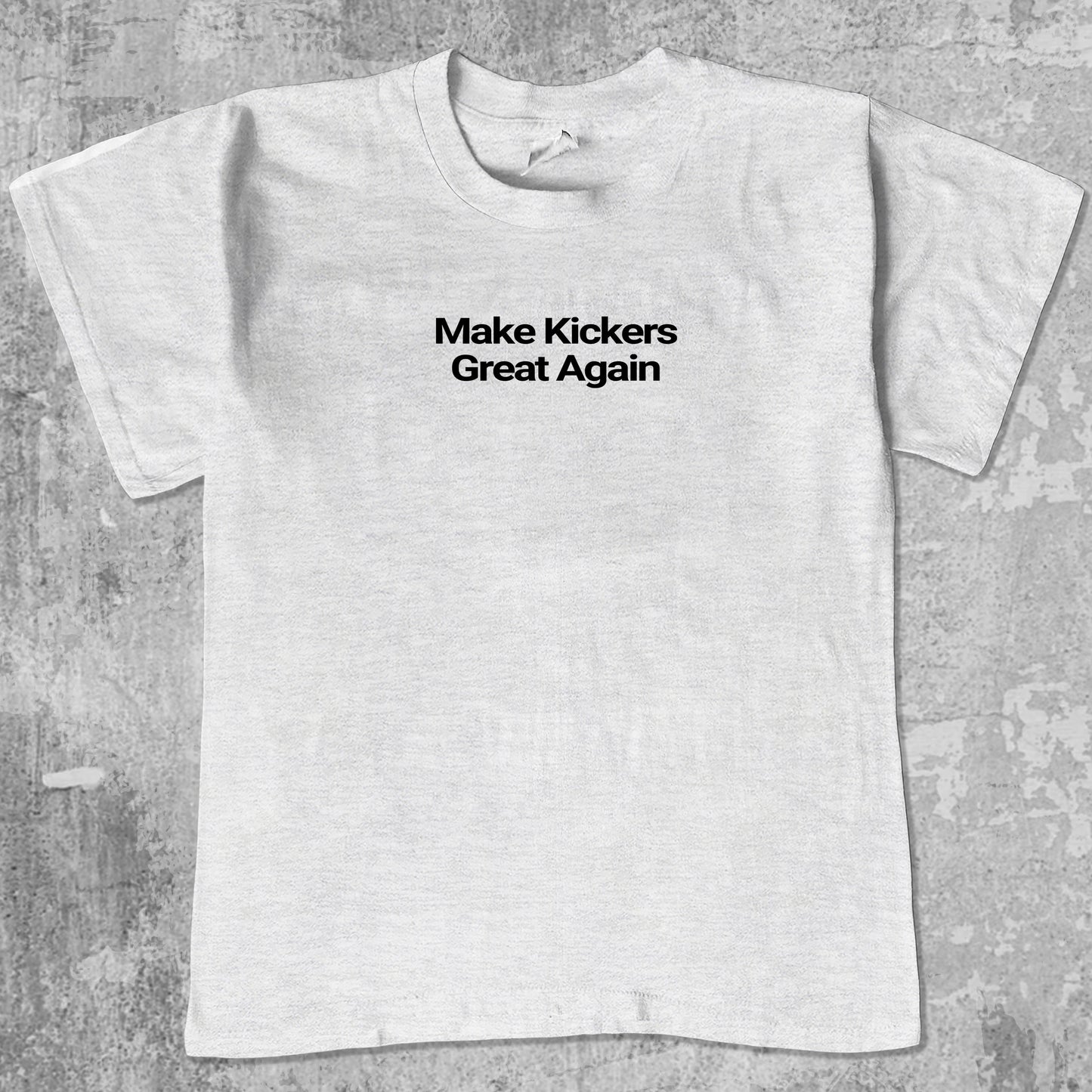 Make Kickers Great Again graphic tee with bold and humorous print, funny and trendy graphic. Perfect for adults and gift-giving. Ash Grey shirt.