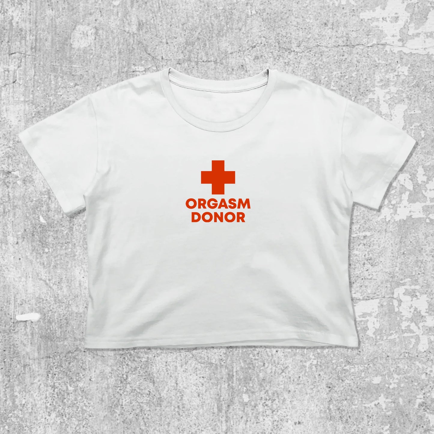 Orgasm Donor graphic crop tee with cute and trendy fit, featuring playful vintage graphic, stylish cut. White crop t-shirt