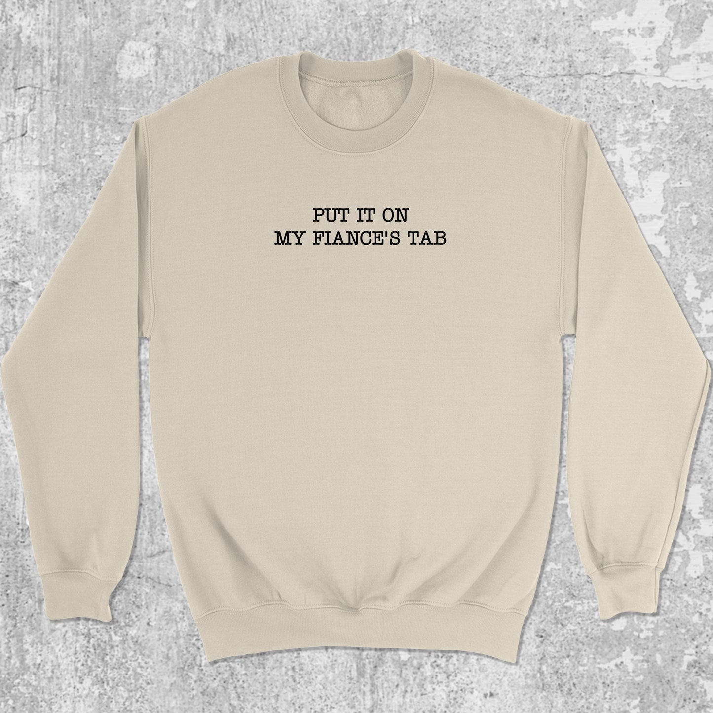 Put It On My Fiance's Tab graphic sweatshirt with bold and humorous print, warm and cozy graphic for everyday wear. Perfect for adults and gift-giving. Natural pullover.
