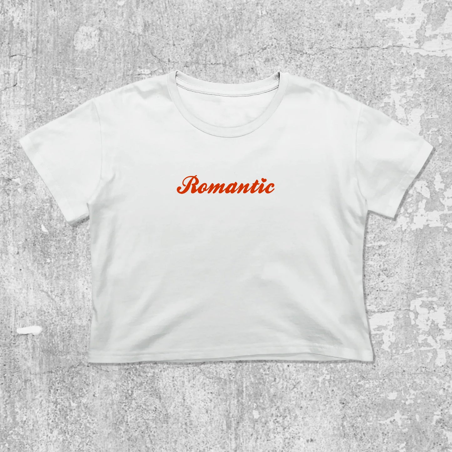 Romantic graphic crop tee with cute and trendy fit, featuring playful vintage graphic, stylish cut. White crop t-shirt