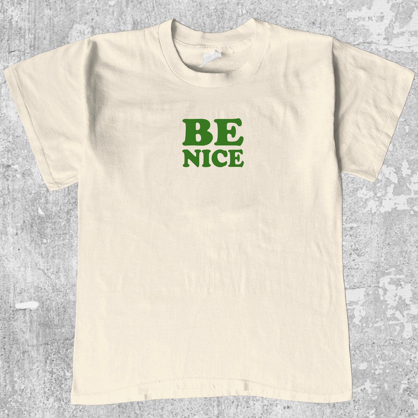 Be Nice graphic tee with bold and humorous print, funny and trendy graphic. Perfect for adults and gift-giving. Cream shirt.