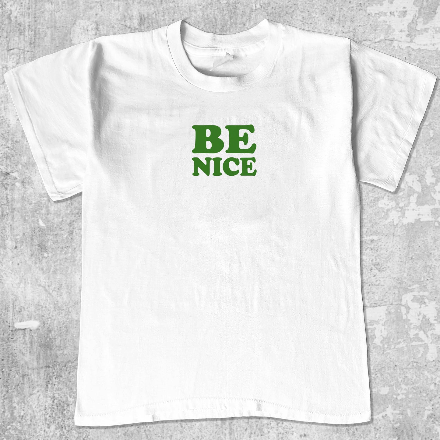 Be Nice graphic tee with bold and humorous print, funny and trendy graphic. Perfect for adults and gift-giving. White shirt.