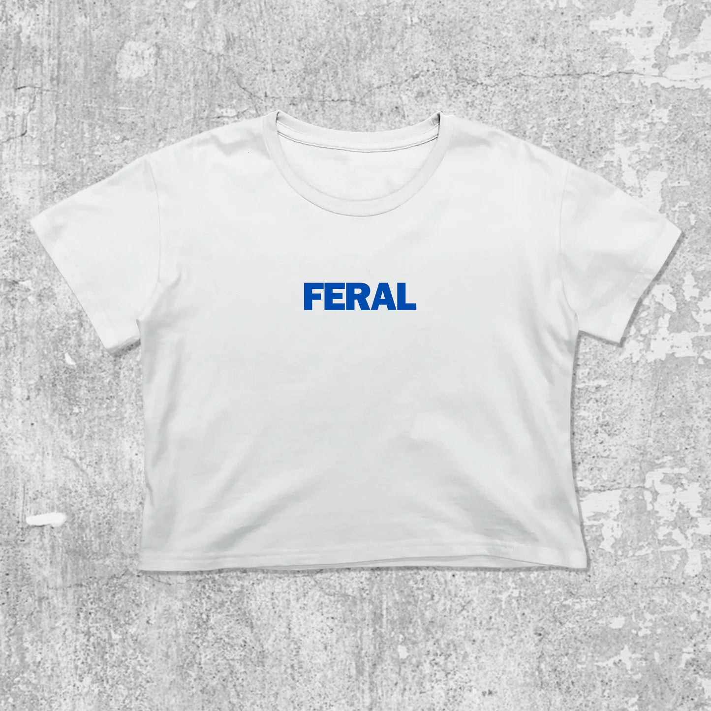 Feral graphic crop tee with cute and trendy fit, featuring playful vintage graphic, stylish cut. White crop t-shirt