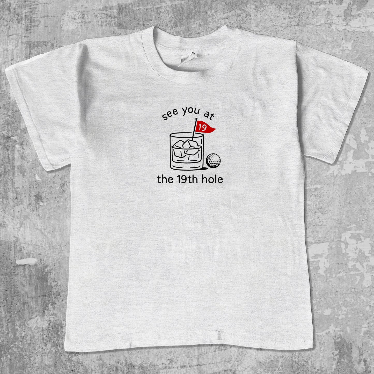 See You At The 19th Hole unisex graphic t-shirt. Vintage trending meme tee. Funny and unique graphic tees. See You At The 19th Hole graphi tee Ash Grey 1