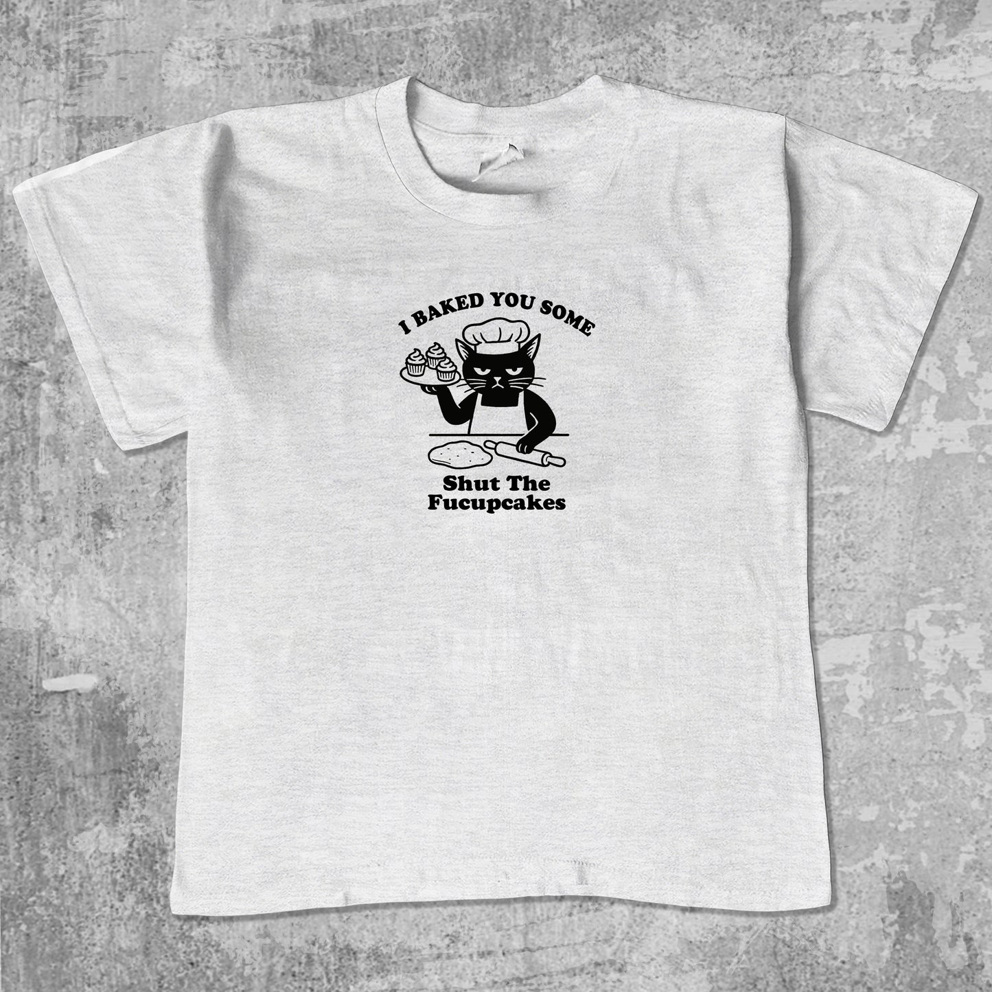 Shut The Fucupcakes unisex graphic t-shirt. Vintage trending meme tee. Funny and unique graphic tees. Shut The Fucupcakes graphi tee Ash Grey 1