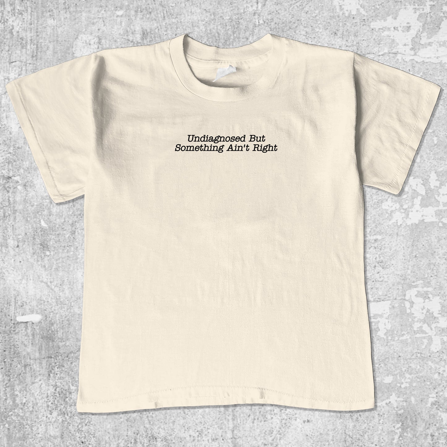 Undiagnosed But Something Ain't Right unisex graphic t-shirt. Vintage trending meme tee. Funny and unique graphic tees. Undiagnosed But Something Ain't Right graphi tee Cream 1