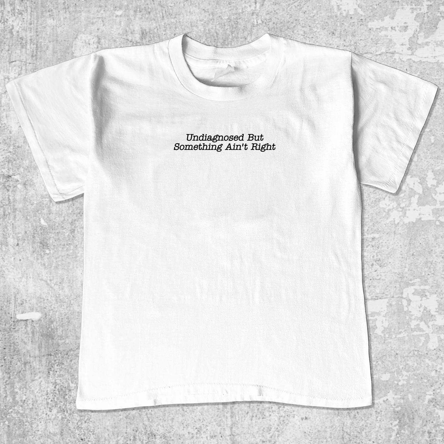 Undiagnosed But Something Ain't Right unisex graphic t-shirt. Vintage trending meme tee. Funny and unique graphic tees. Undiagnosed But Something Ain't Right graphi tee White 1