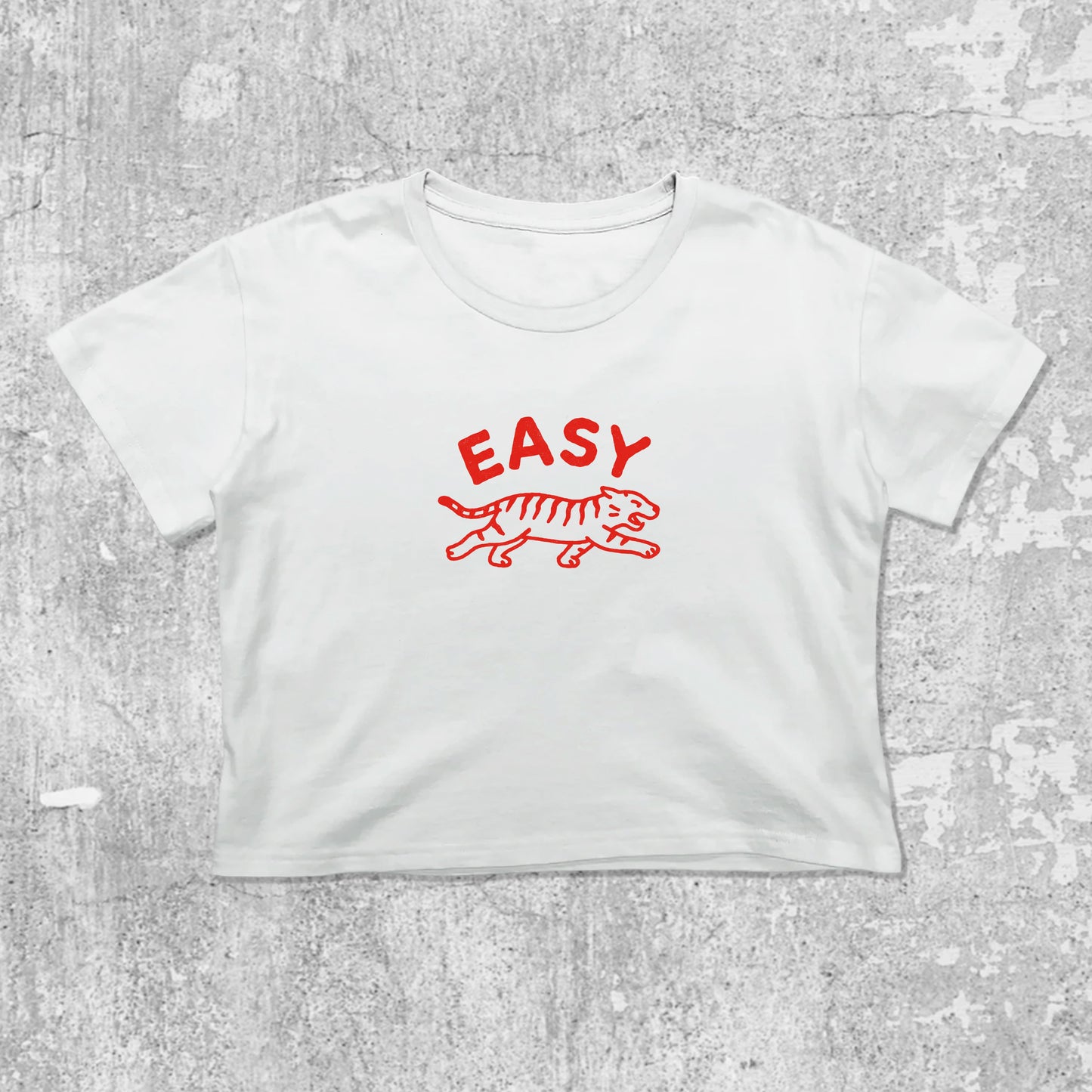 Easy Tiger graphic crop tee with cute and trendy fit, featuring playful vintage graphic, stylish cut. White crop t-shirt