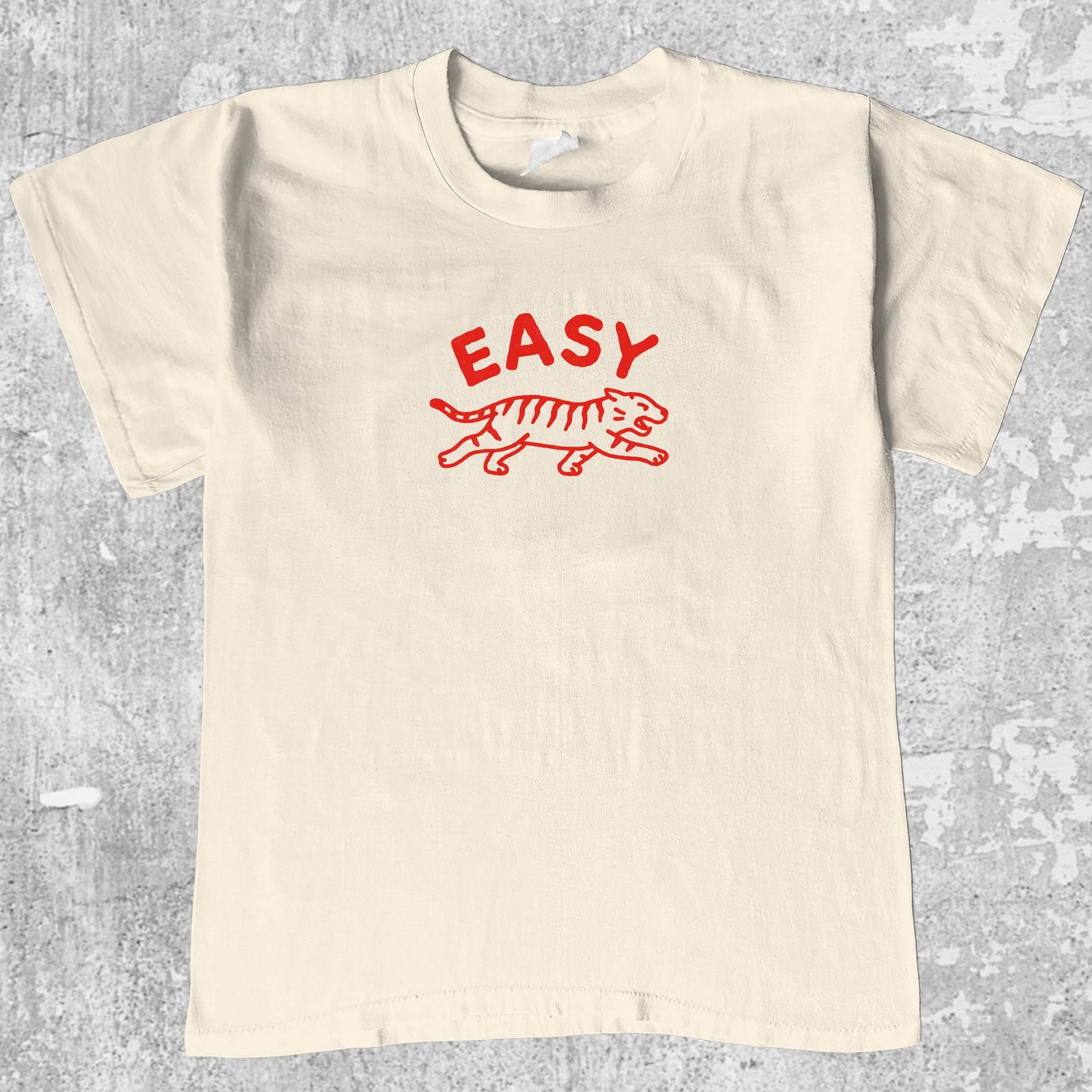 Easy Tiger graphic tee with bold and humorous print, funny and trendy graphic. Perfect gifts for friends and family. Cream shirt.
