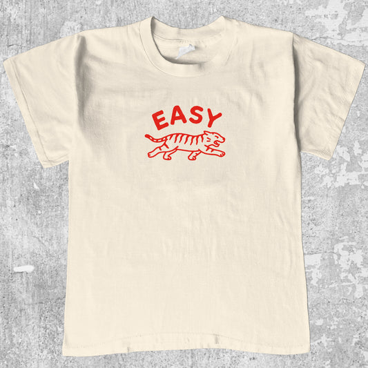 Easy Tiger graphic tee with bold and humorous print, funny and trendy graphic. Perfect gifts for friends and family. Cream shirt.