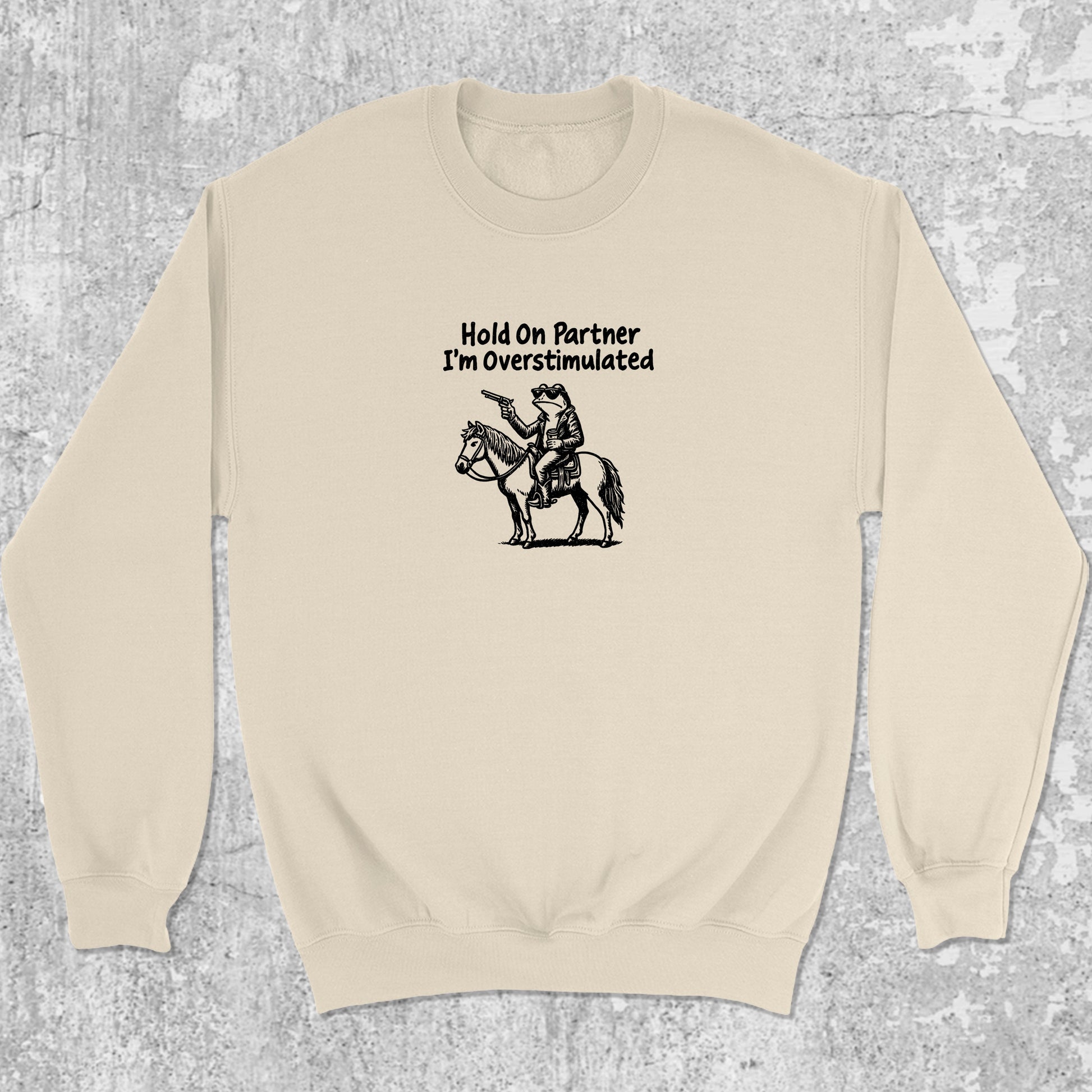 Hold On Partner I'm Overstimulated graphic sweatshirt with funny frogs print, warm and cozy graphic for everyday wear. Perfect for Christmas gifts for friends and family. Natural pullover.