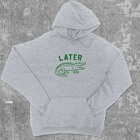 Later Gator graphic hoodie with funny and trendy artwork, casual streetwear with bold personality. Great for adults and gifting. Heather Grey hoodie.