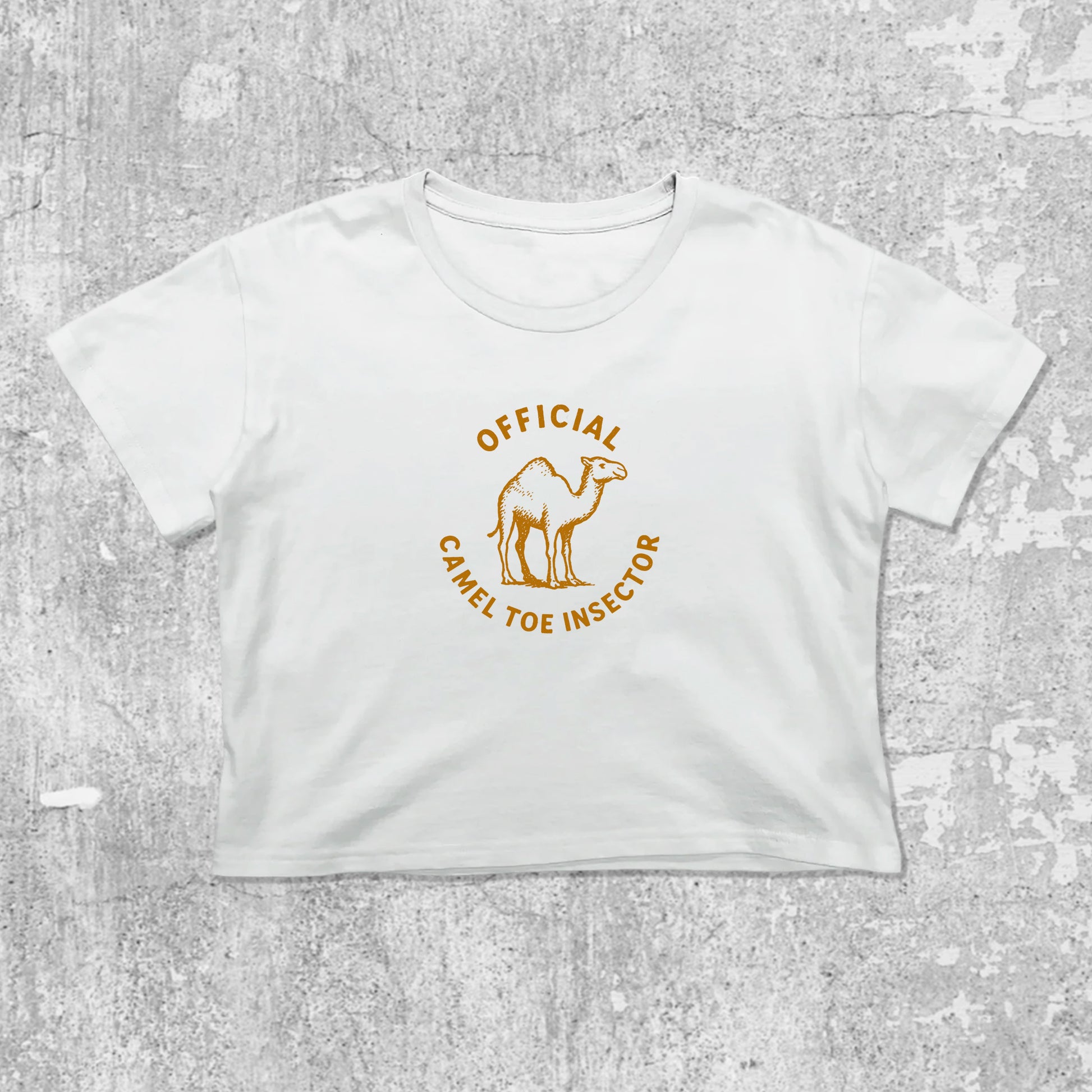 Official Camel Toe Inspector graphic crop tee with cute and trendy fit, featuring playful vintage graphic, stylish cut. White crop t-shirt