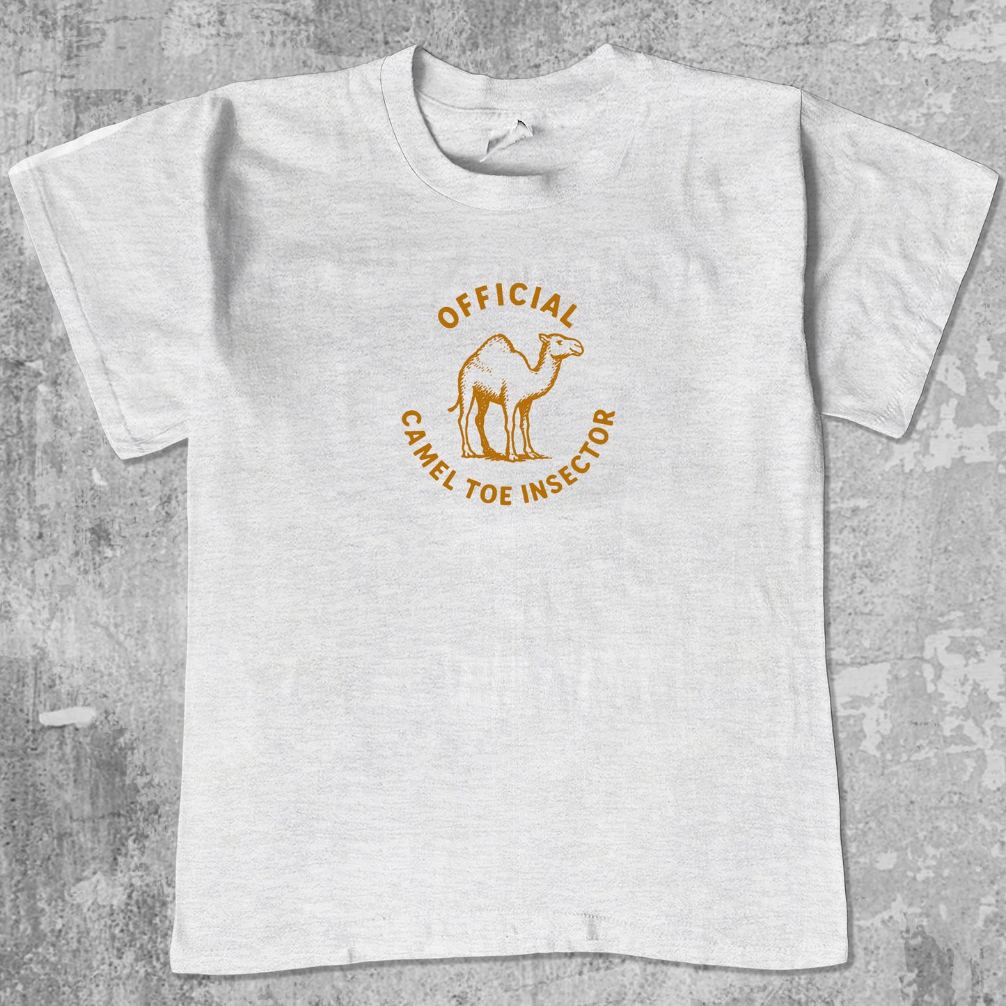 Official Camel Toe Inspector graphic tee with bold and humorous print, funny and trendy graphic. Perfect for adults and gift-giving. Ash Grey shirt.