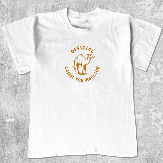 Official Camel Toe Inspector graphic tee with bold and humorous print, funny and trendy graphic. Perfect for adults and gift-giving. White shirt.