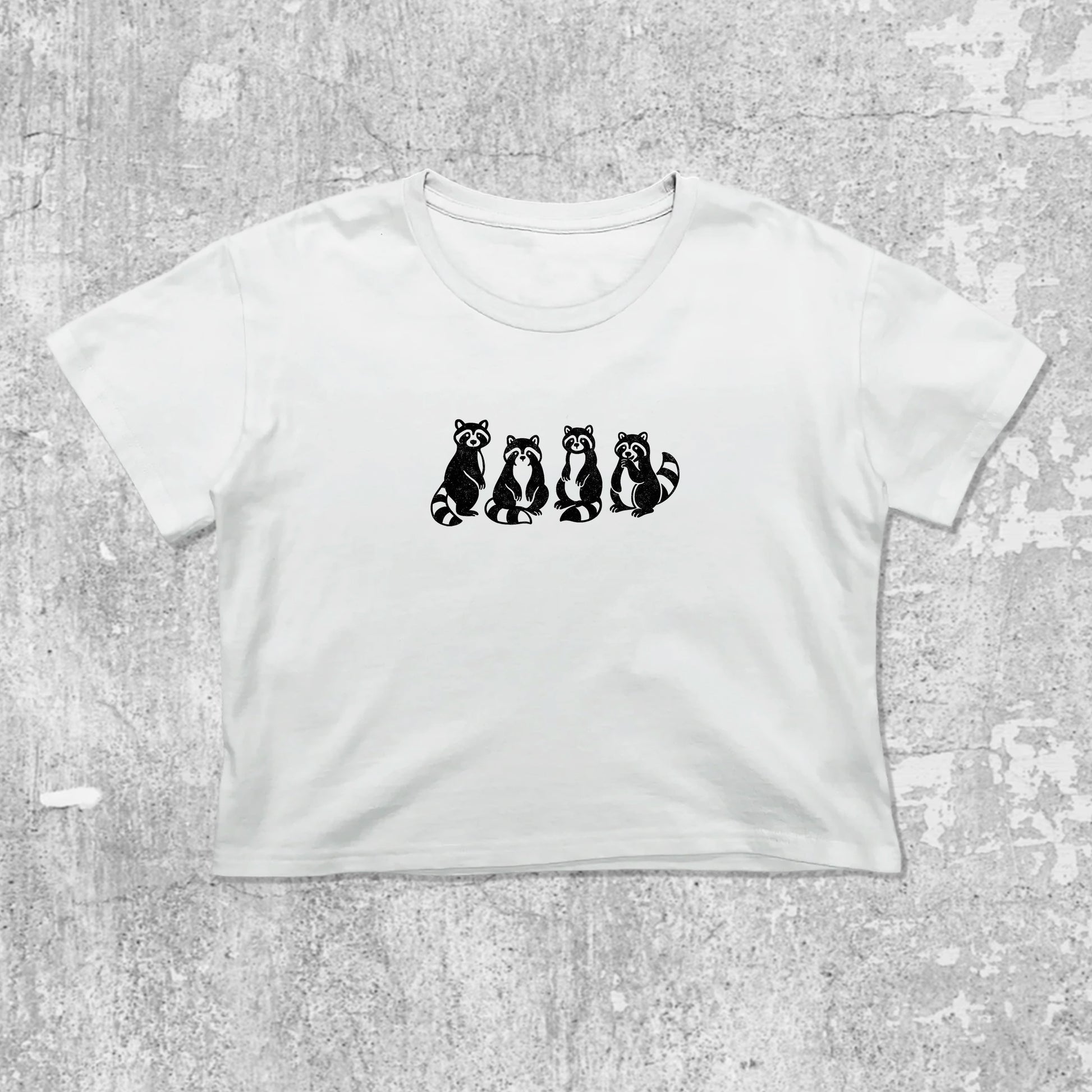 Raccoons graphic crop tee with cute and trendy fit, featuring playful vintage graphic, stylish cut. White crop t-shirt