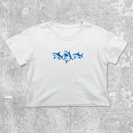 Sharks graphic crop tee with cute and trendy fit, featuring playful vintage graphic, stylish cut. White crop t-shirt