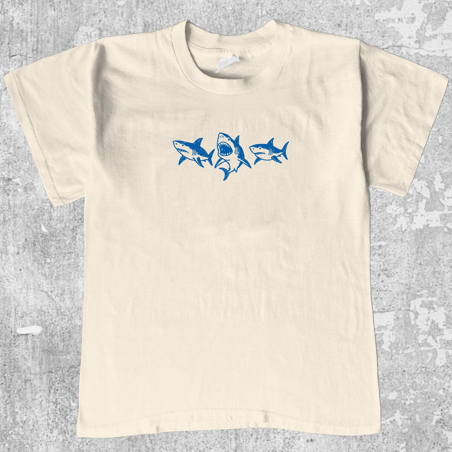 Sharks graphic tee with sharks doodle print, funny and simple graphic. Perfect gifts for family and friends. Cream shirt.