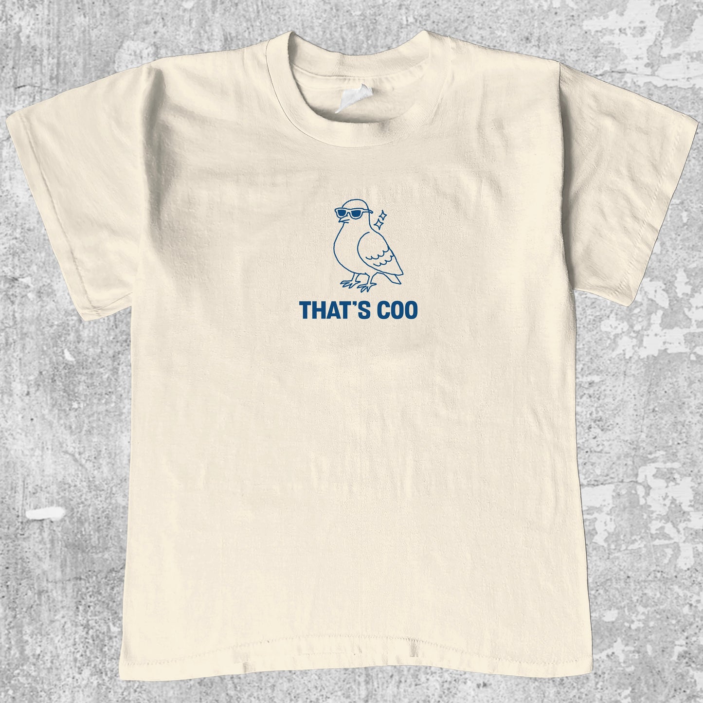 That's Coo graphic tee with bold and humorous print, funny and trendy graphic. Perfect for adults and gift-giving. Cream shirt.