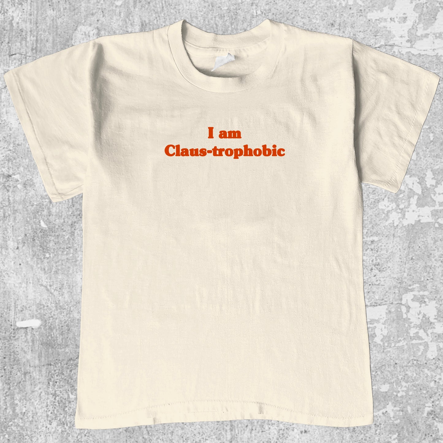 I'm Claus-trophobic graphic tee with cute and humorous print, funny and Vintage graphic. Perfect for christmas gifts. Cream shirt.