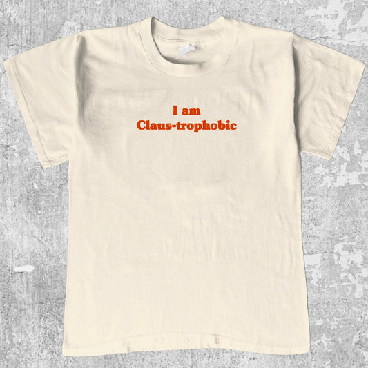 I'm Claus-trophobic graphic tee with cute and humorous print, funny and Vintage graphic. Perfect for christmas gifts. Cream shirt.