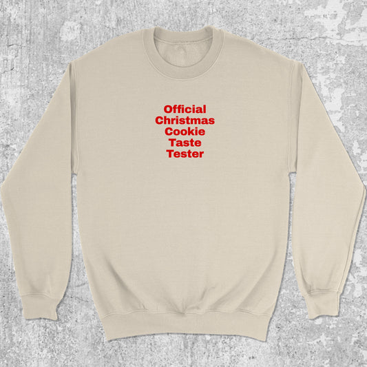 Official Christmas Cookie Taste Tester graphic sweatshirt with bold and humorous print, warm and cozy graphic for everyday wear. Perfect for adults and gift-giving. Natural pullover.